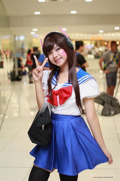 A Woman Dressed In A Sailor Costume Posing For The Camera With Her