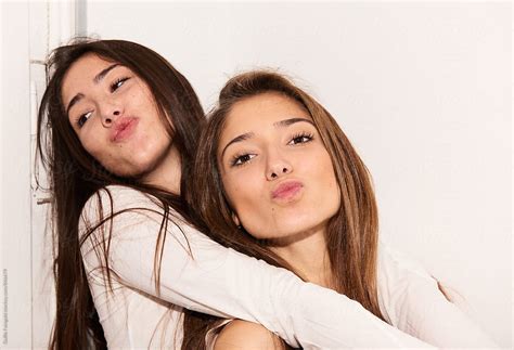 Two Young Women Hugging And Making Duck Faces By Guille Faingold