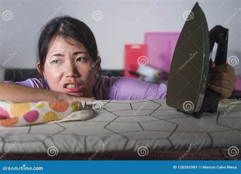 Young Beautiful Tired And Frustrated Asian Chinese Woman Holding