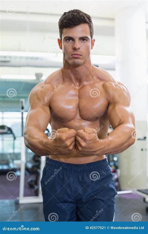 Shirtless Muscular Man Flexing Muscles In Gym Stock Image Image Of