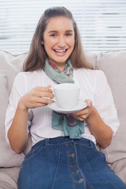 premium photo smiling pretty model holding coffee