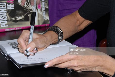 Vera Ramone King Signs A Copy Of Poisoned Heart I Married Dee Dee