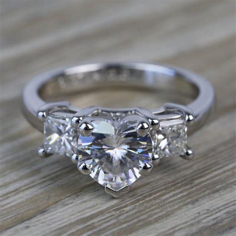 Be inspired by our designer engagement rings. 6.5mm Heart Moissanite & Princess Diamond Engagement Ring