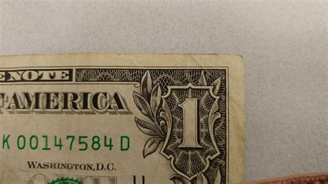 Theres A Spider On The Us One Dollar Bill Sitting On The Left Edge Of