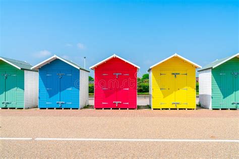 A Row Of Colorful Wooden Beach Huts On The Beach In Eastbourne Stock