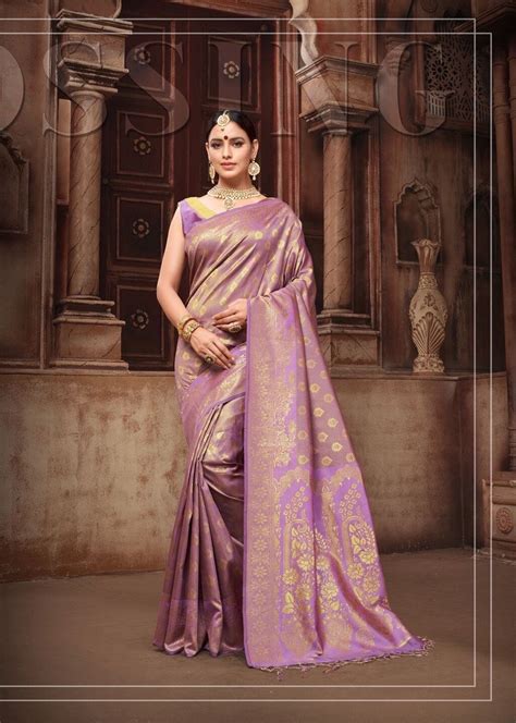 A Woman In A Purple And Gold Sari