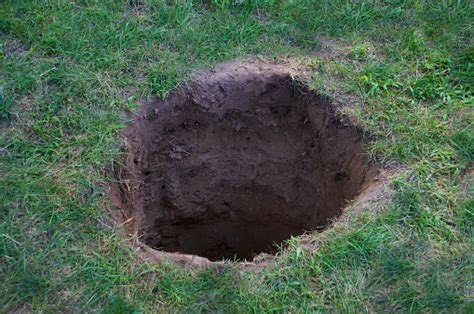 Deep Dirt Hole In Ground Or Lawn Stock Photo Download Image Now Istock