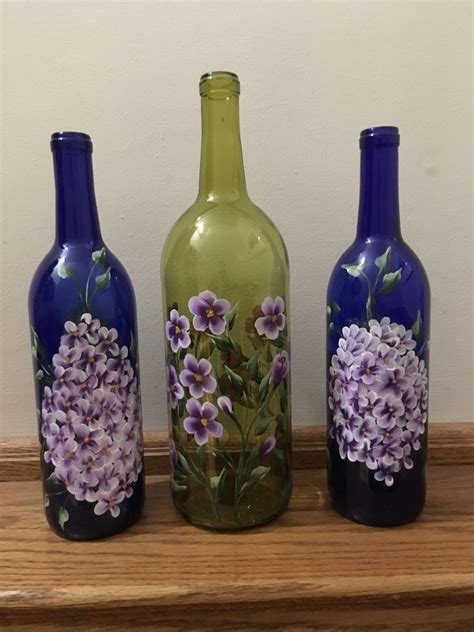 Beautiful long blooming purple flowers and purple bean pods form along this vine making it a very inviting sight to see. Purple flowers bottles with lights | Painted wine bottles ...