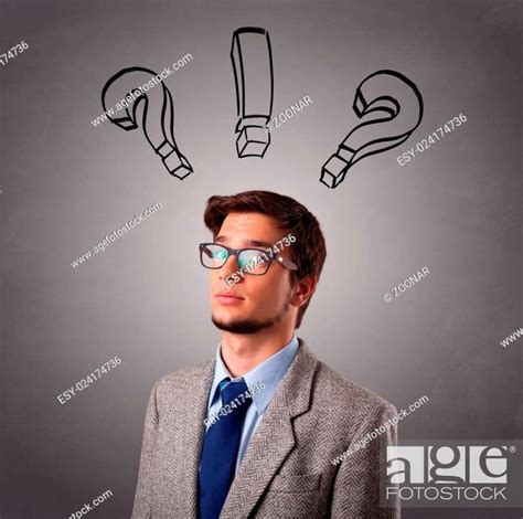 Young Man Thinking With Question Marks Overhead Stock Photo Picture