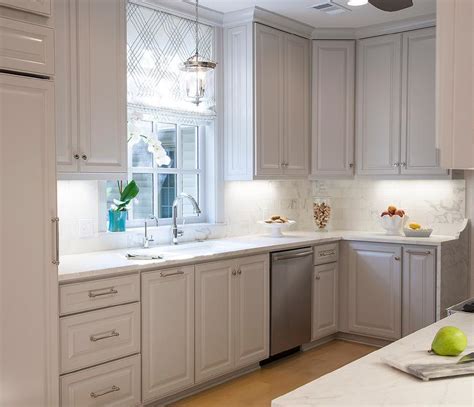 It offers a beautiful and tasteful design that will enhance the look of any kitchen. White Raised Panel Cabinets Design Ideas