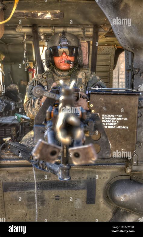 A Uh 60 Black Hawk Door Gunner Manning A M240b Machine Gun Tikrit