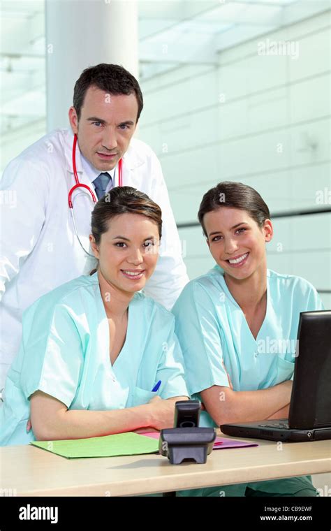 Physician And Female Nurses Stock Photo Alamy