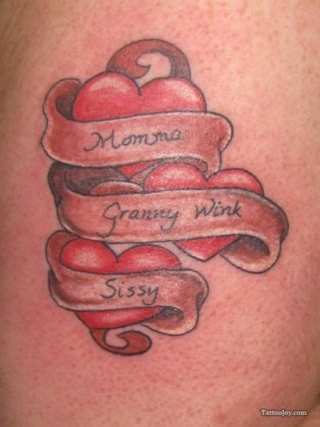 This heart tattoo is quite floral and contains the names of the loved ones attached to it. heart tattoos with names | Hearts Banners Names Tattoo ...