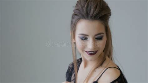 Beautiful Young Woman In Black Lingerie On A Photo Shoot Stock Footage