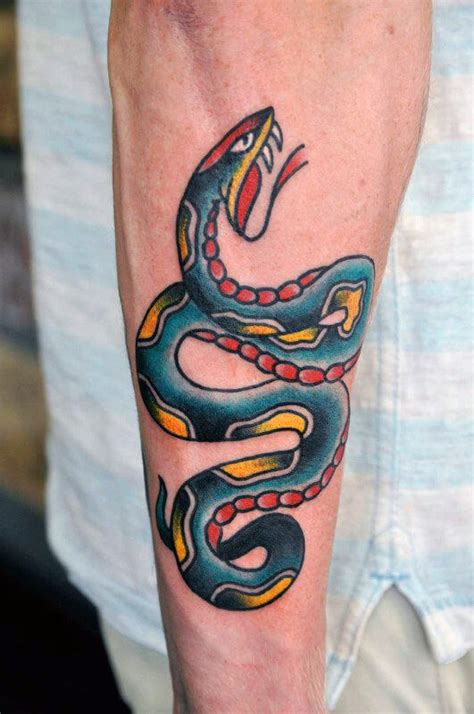 Snake tattoo meaning design understanding them chronic ink. 14 American Traditional Snake Tattoo Designs | PetPress