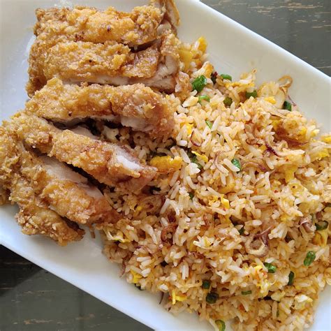 Nasi goreng is often described outside of its region of origin, maritime southeast asia, as an indonesian rice dish cooked with pieces of meat and vegetables. Nasi Goreng Merah Ayam Crispy