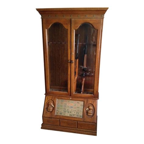 An unusual antique 'american country' gun/rifle display cabinet, circa 1920. Duck Carved Gun Display Cabinet | Chairish