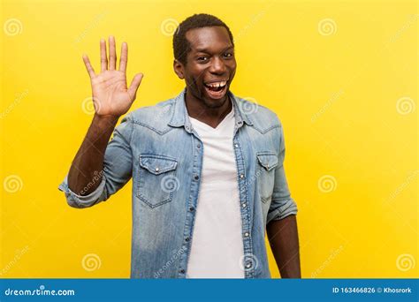 Hello Portrait Of Positive Handsome Man Smiling Friendly And Waving