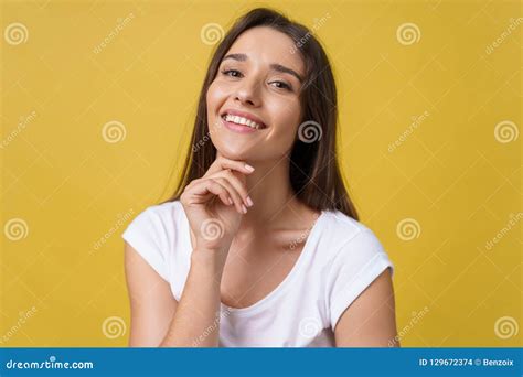 Happy Cheerful Young Woman With Joyful And Charming Smile Isolated Over
