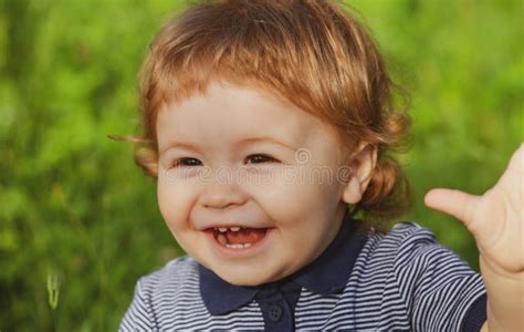 Portrait Of Cute Excited Boy Having Fun In Garden Baby Face Close Up
