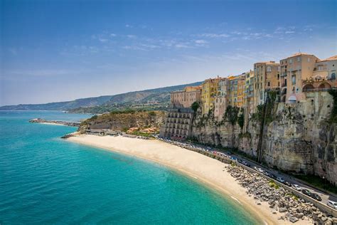 An area of sand or small stones near the sea or another area of water such as a lake: 12 Reasons to Visit Tropea, Italy