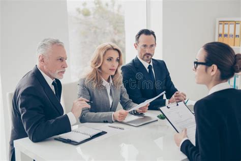 Two Stylish Business Persons In Suits Having Disagreement War Stock