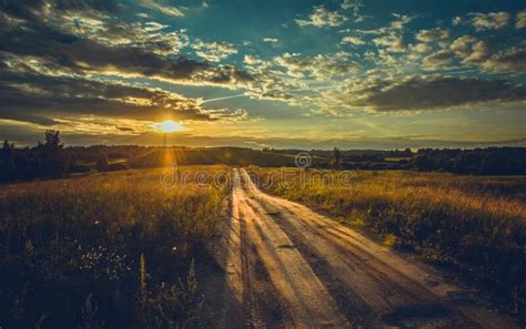 Sunset And Path Through A Meadow Stock Photo Image Of Mysterious