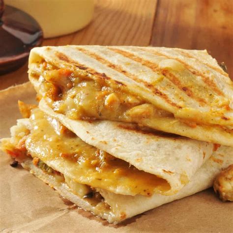 Tortillas stuffed with cheese and whatever else your heart desires, pan fried until the interior is melted. Easy Chicken Quesadillas Recipe - Nerdy Mamma