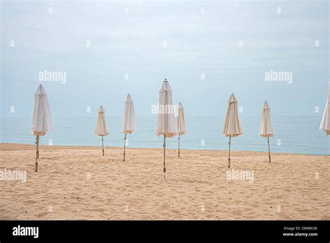 Folded Umbrella On Beach Stock Photo Alamy