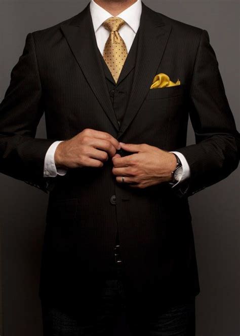 Save with a rental package. black suit with nice gold tie & yellow pocket highlights | Suits, Well dressed men, Mens fashion ...