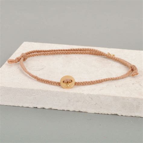 Gold Button And Thread Bracelet By Lindsay Pearson