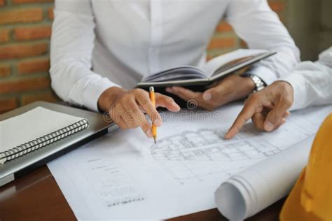 Architect Construction Engineer Plan On Hard Project At Working Stock