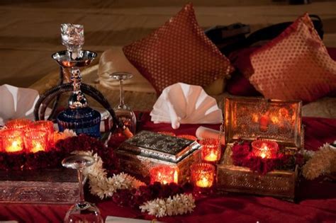Decorate the venue according to the red, black and white theme too. Design & Decor sufi night , ghazal night , mughal , hookah ...