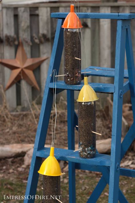 I'd love to report on how the birds liked them, but as soon as. How to Make Water Bottle Bird Feeders - Empress of Dirt