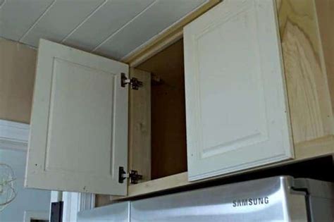 A huge gaping, useless hole has potential and i'll show you how easy it is to make a box with a door. DIY Refrigerator Cabinet