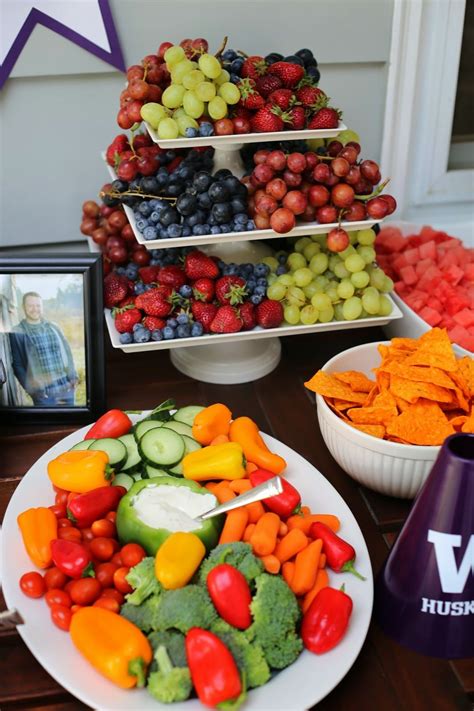 My daughter's graduation party started at 4pm and went through the evening. UW Graduation party food table. purple and gold party. Use ...