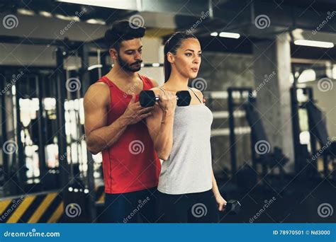 Personal Trainer Instructing Trainee Stock Image Image Of Exercising
