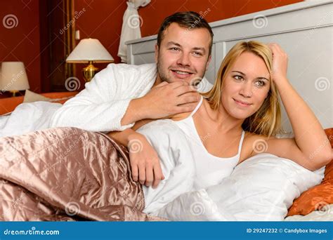 Smiling Husband And Wife Striking A Romantic Pose Stock Photo Cartoondealer Com