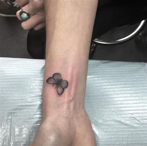 Butterfly with black heart on wrist. 28 Beautiful Black and Grey Butterfly Tattoos - TattooBlend