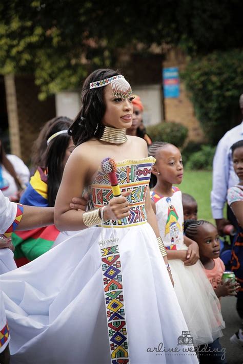 Gorgeous strapless mermaid wedding dress with a ruffled skirt and a textural look. Zulu traditional wear inspired white wedding gown | Afro ...