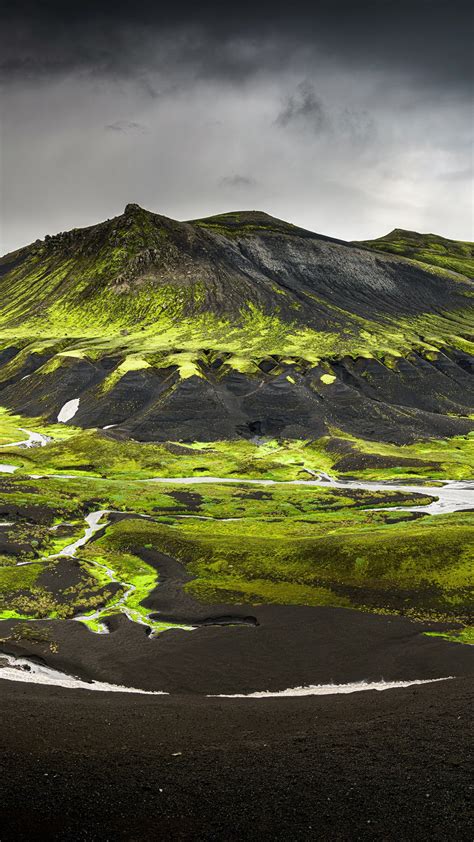 Landscape View Of Green And Black Covered Mountain In Iceland Under