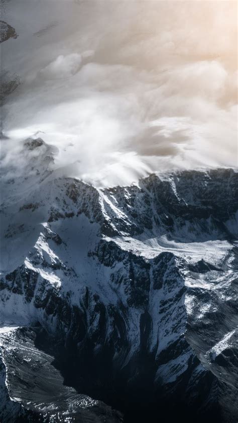 Snow Covered Mountain Under Cloudy Sky During Dayt Iphone Wallpapers