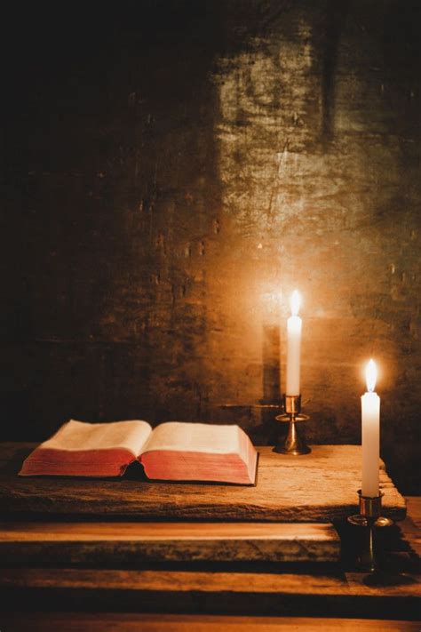 Download Open Holy Bible And Candle On A Old Oak Wooden Table. for free ...