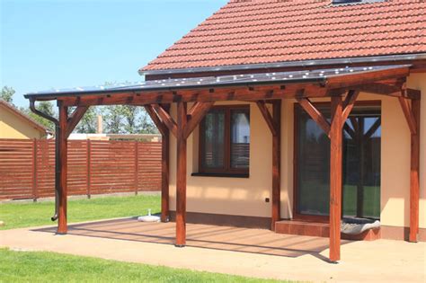 The ledger board is attached in a horizontal position. How to Attach a Patio Roof to an Existing House