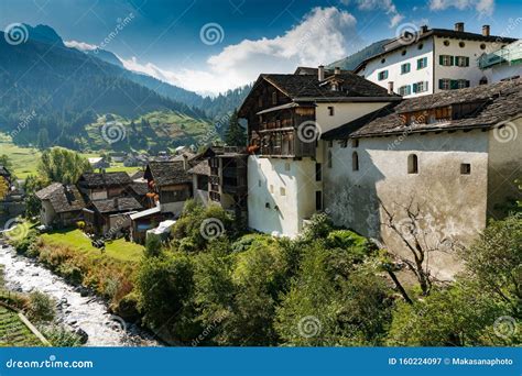 Picturesque Mountain Village With White Stone Houses And Stone Roofs In