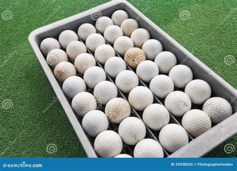 Rows Of Golf Balls In Tray On Green Koh Pha Ngan Thailand Stock Photo