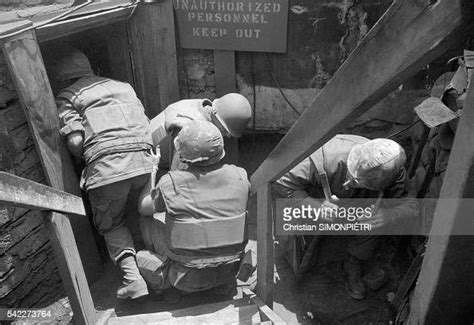 Soldiers Under North Vietnamese Mortar Fire In The Trenches Of The