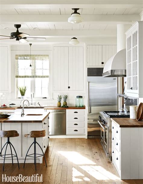 White kitchen cabinets contrasted with oil rubbed bronze pulls are fixed against a white tongue and groove backsplash over blue lower cabinets finished with. Black Hardware: Kitchen Cabinet Ideas - The Inspired Room