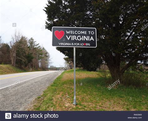 Welcome To Virginia Sign On The Side Of A Road Between North Carolina