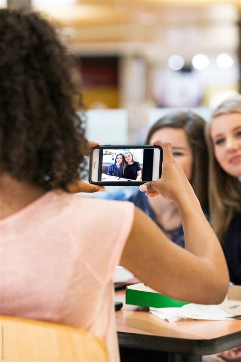 Mall Teen Girls In Food Court Using Phone To Take Photos Of Eac By